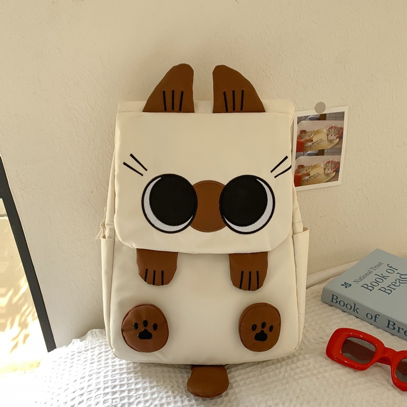 White Lightweight Nylon Waterproof Schoolbag for Children - Large Capacity Daypack with Ugly-Cute Cat Design